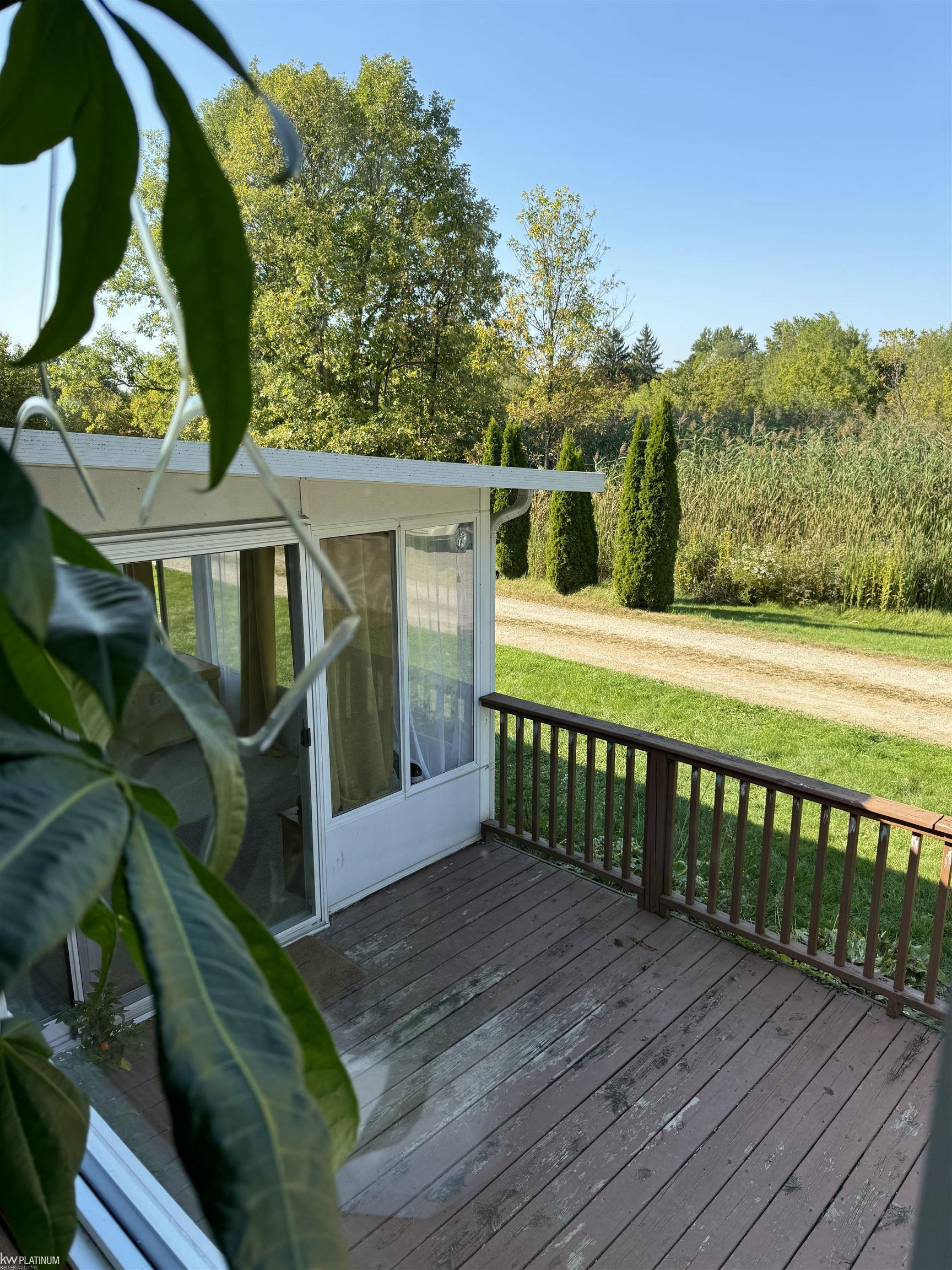 4056 Hemphill Road Burton, MI 48519 - Photo 17 of 29 Sunroom and Deck