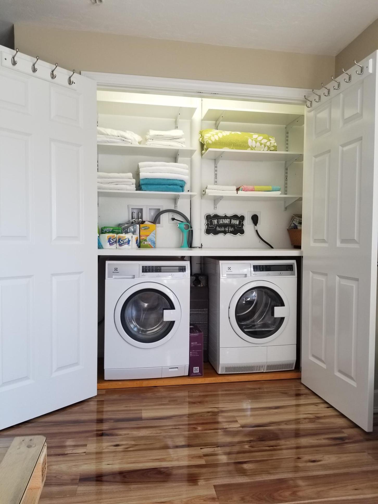 49 E Main Street Buzzards Bay, MA 02532 - Photo 10 of 15 a view of washer and dryer with wooden floor