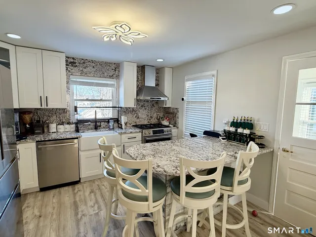 a kitchen with a table and chairs in it