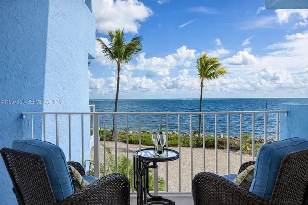 a view of a balcony with furniture
