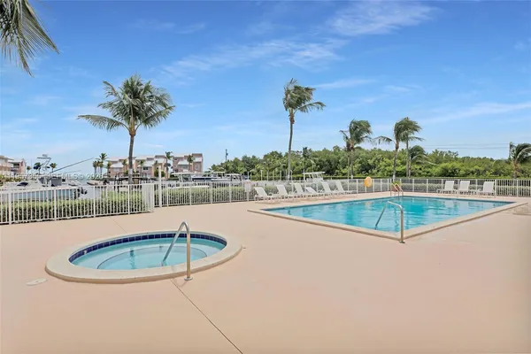 a view of a swimming pool with a patio