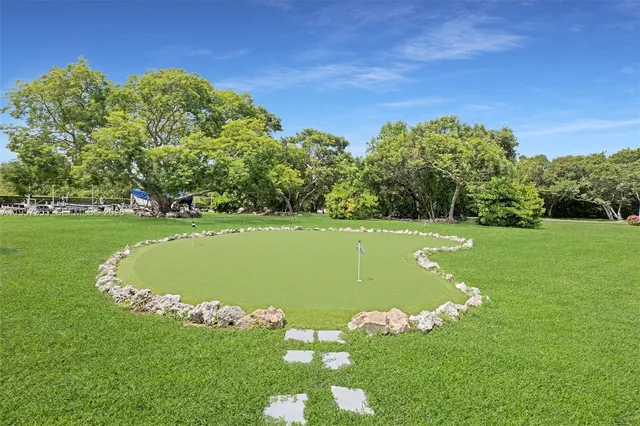 a view of a road with a building in the background