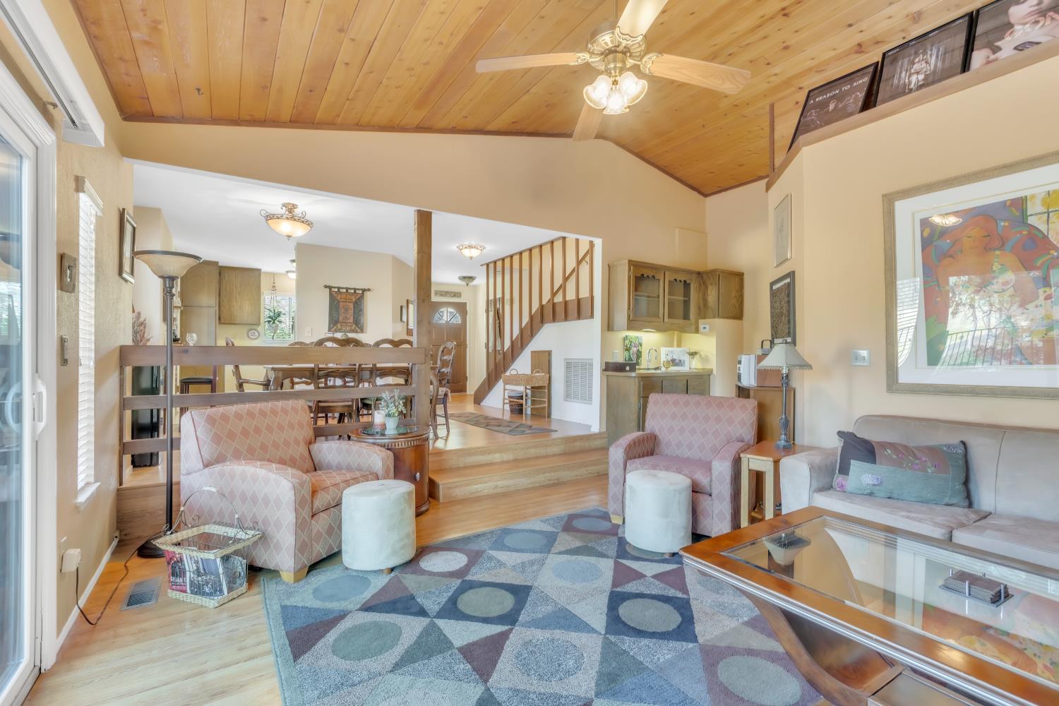 65 Poker Flat Road Copperopolis, CA 95228 - Photo 14 of 30 a living room with fireplace furniture and a chandelier