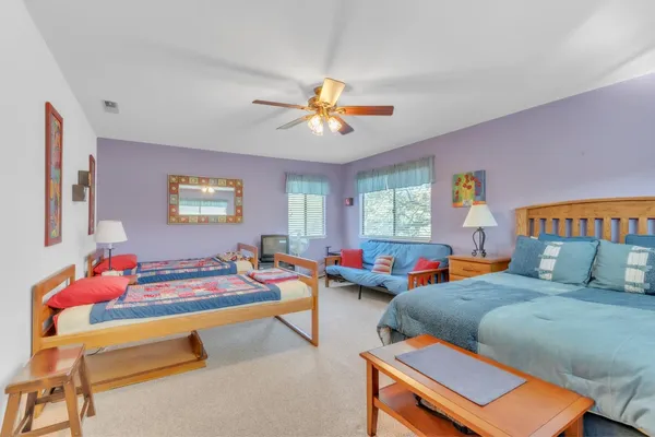 a bedroom with a bed and window