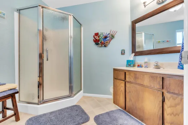 a room with mirror and furniture