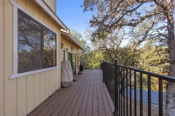 a view of a house with wooden deck