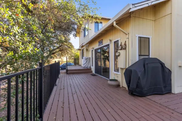 a view of a house with wooden deck