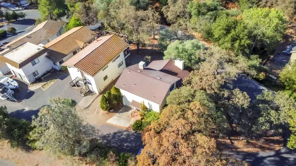 an aerial view of house with yard