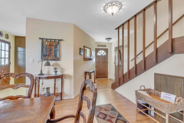 a view of a livingroom with furniture and workspace