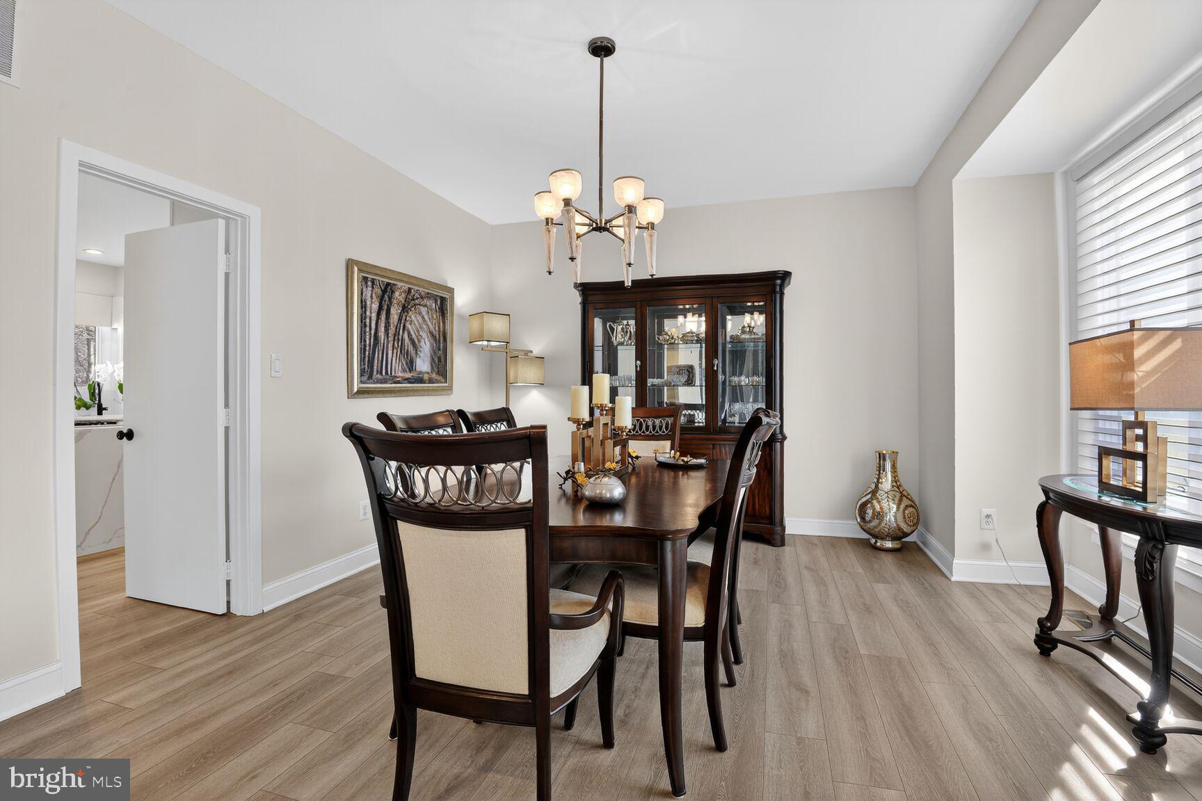11300 Water Pointe Circle Reston, VA 20194 - Photo 16 of 36 a view of a dining room with furniture window and wooden floor