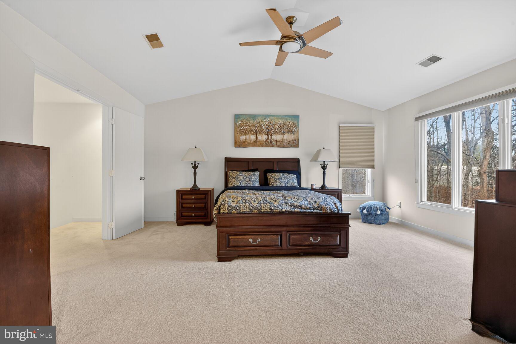 11300 Water Pointe Circle Reston, VA 20194 - Photo 17 of 36 a bedroom with a bed and large windows