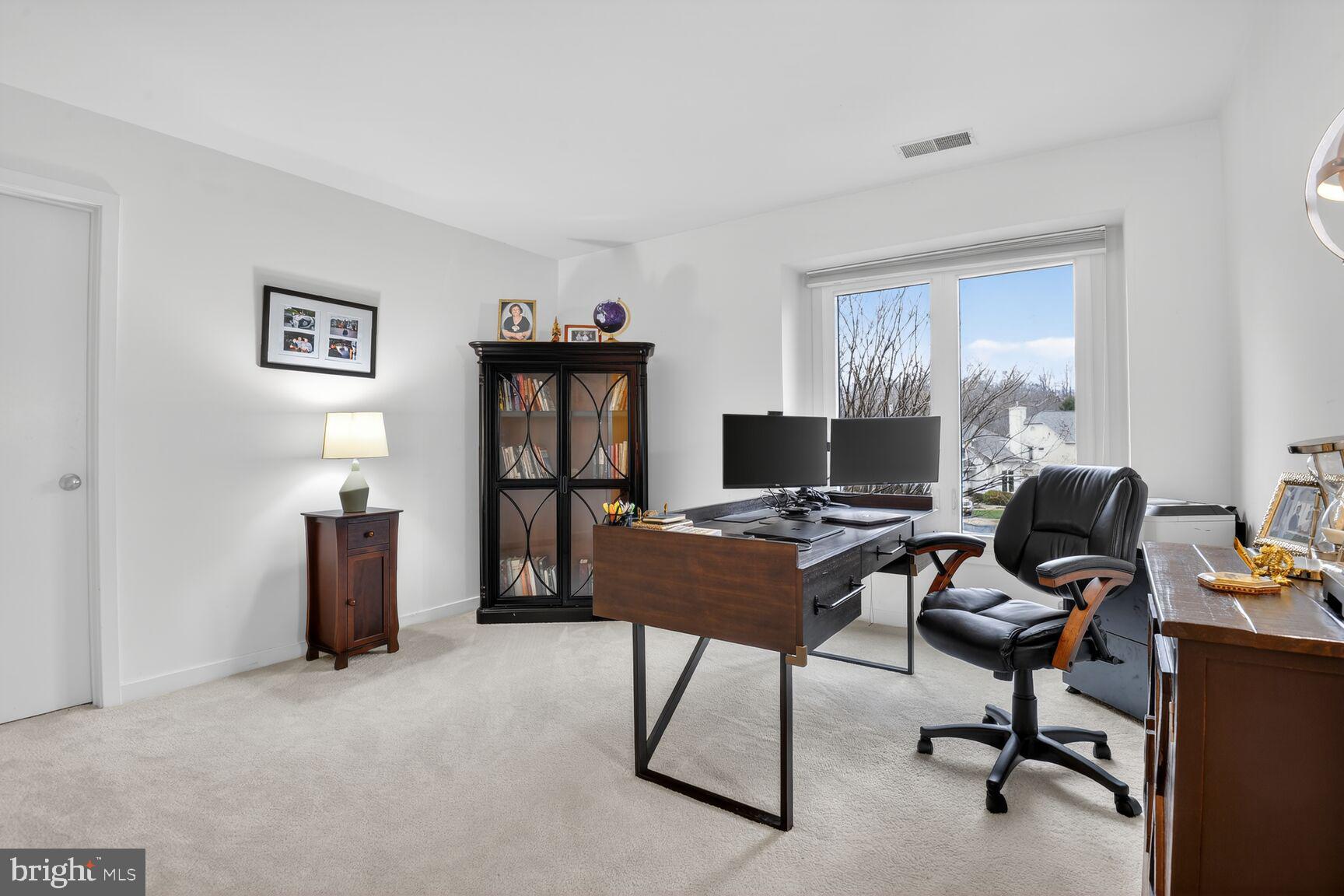 11300 Water Pointe Circle Reston, VA 20194 - Photo 20 of 36 a view of a workspace with furniture and a window