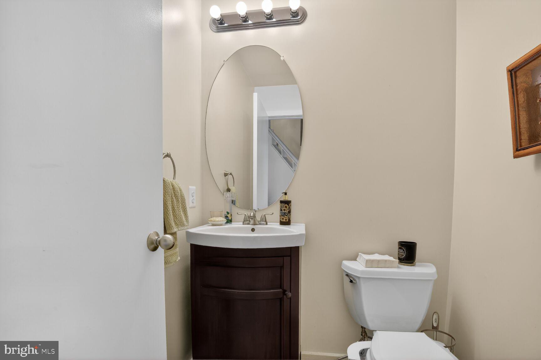 11300 Water Pointe Circle Reston, VA 20194 - Photo 30 of 36 a bathroom with a toilet sink and mirror