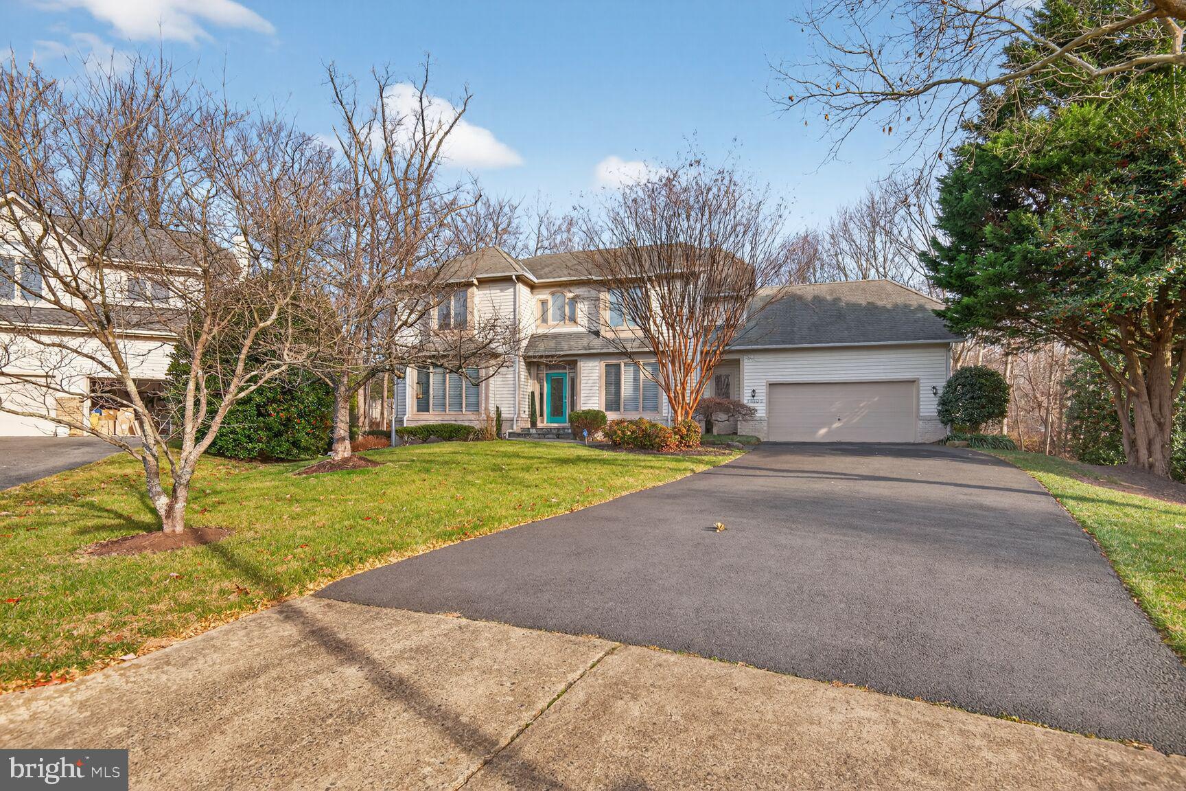 11300 Water Pointe Circle Reston, VA 20194 - Photo 36 of 36 a front view of a house with a yard and garage