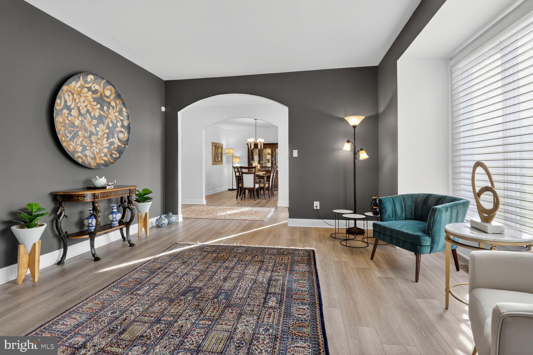 11300 Water Pointe Circle Reston, VA 20194 - Photo 5 of 36 a living room with furniture a rug and a large window
