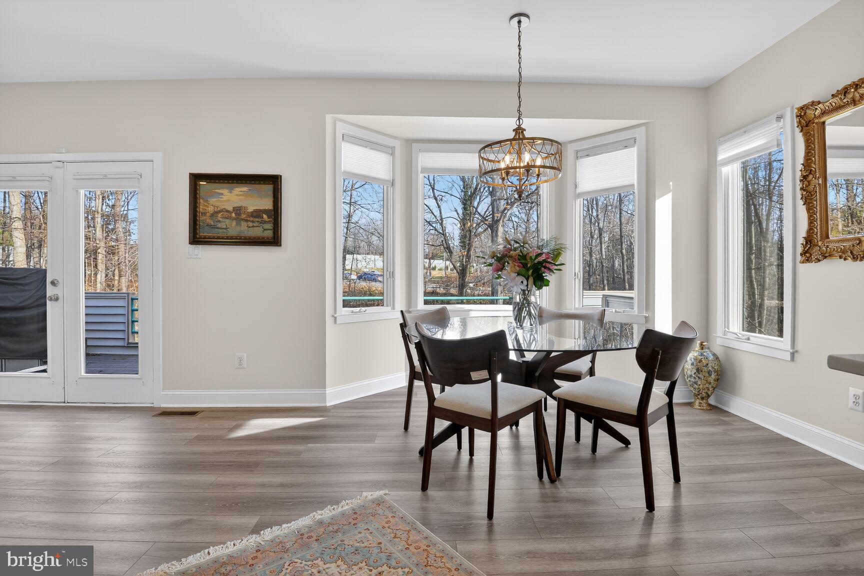 11300 Water Pointe Circle Reston, VA 20194 - Photo 8 of 36 a view of a dining room with furniture window and wooden floor