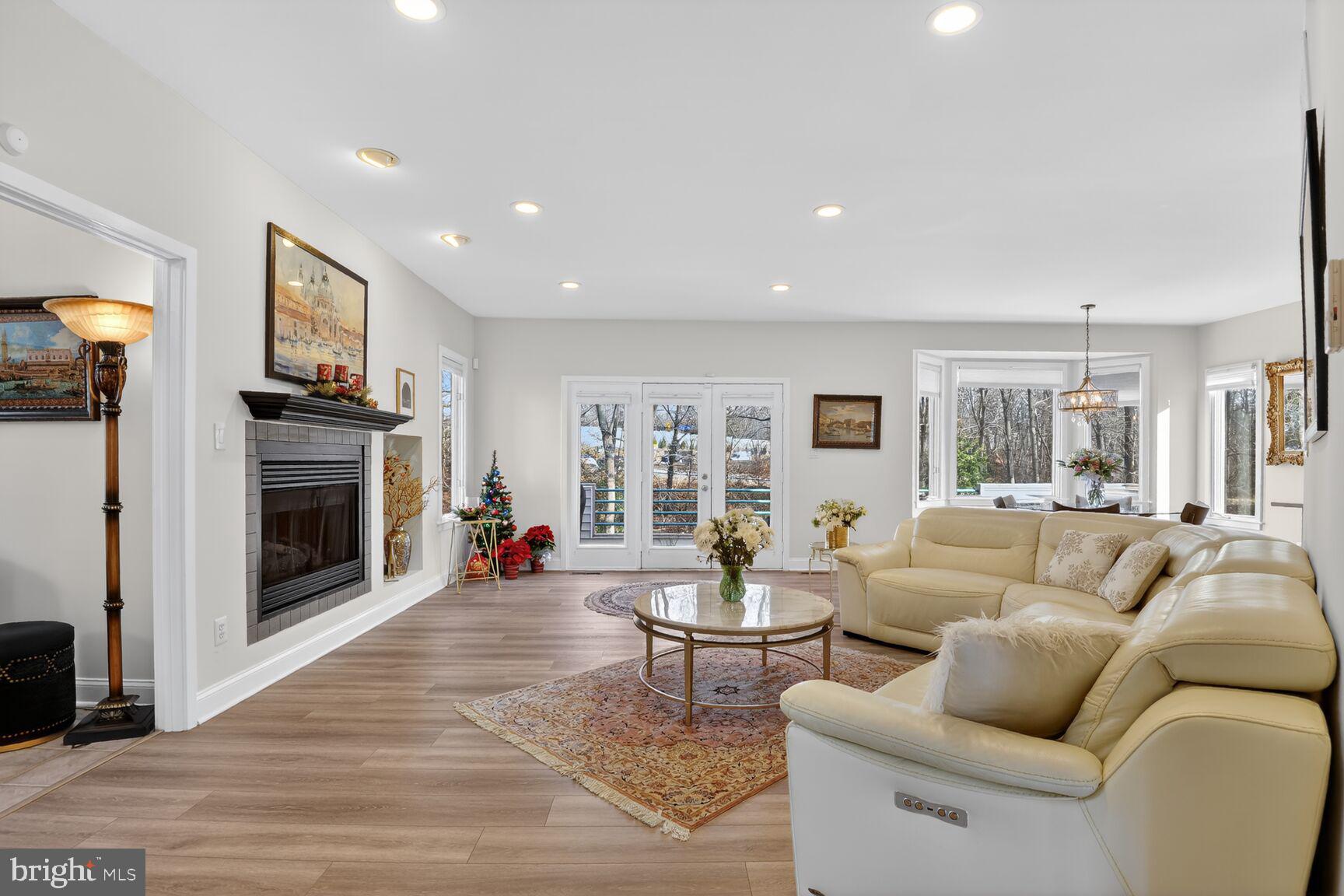 11300 Water Pointe Circle Reston, VA 20194 - Photo 10 of 36 a living room with furniture and a fireplace