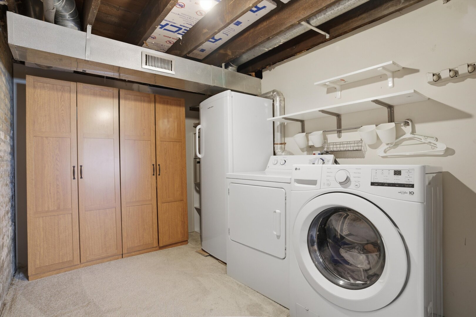 1958 West George Street, Unit 1 Chicago, IL 60657 - Photo 19 of 30 a utility room with dryer and washer