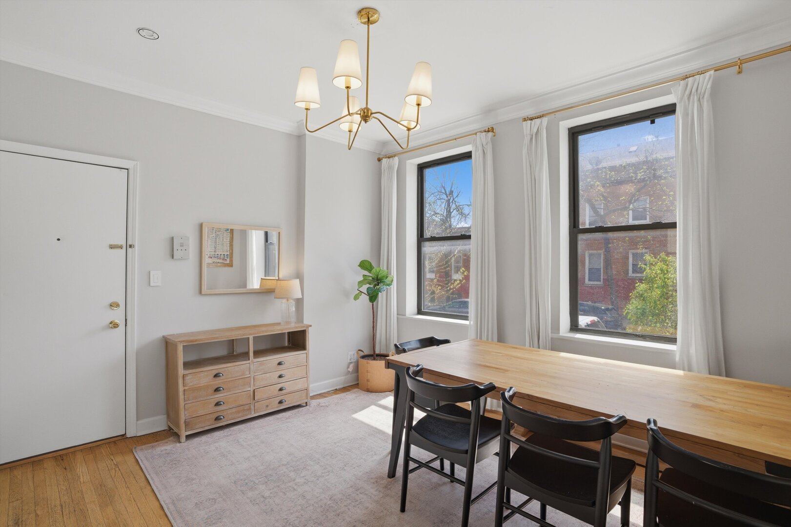 1958 West George Street, Unit 1 Chicago, IL 60657 - Photo 2 of 30 a view of a dining room with furniture window and wooden floor