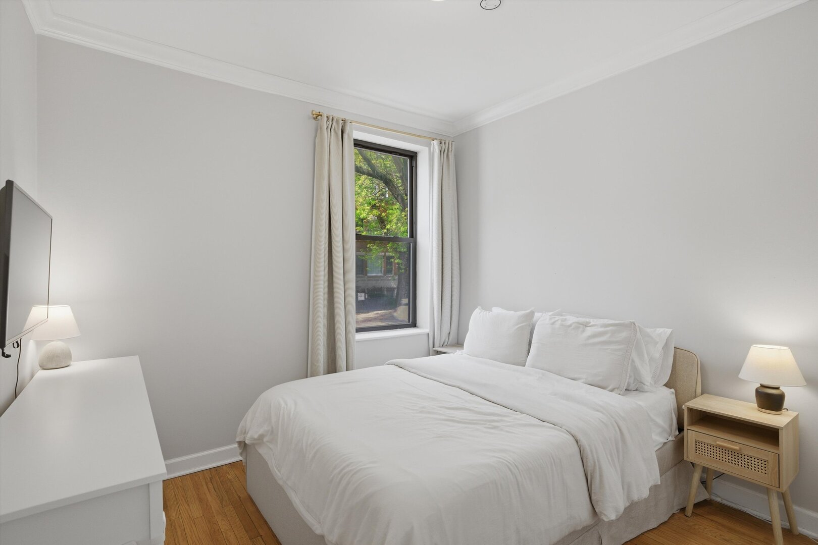 1958 West George Street, Unit 1 Chicago, IL 60657 - Photo 10 of 30 a bedroom with a bed and a window