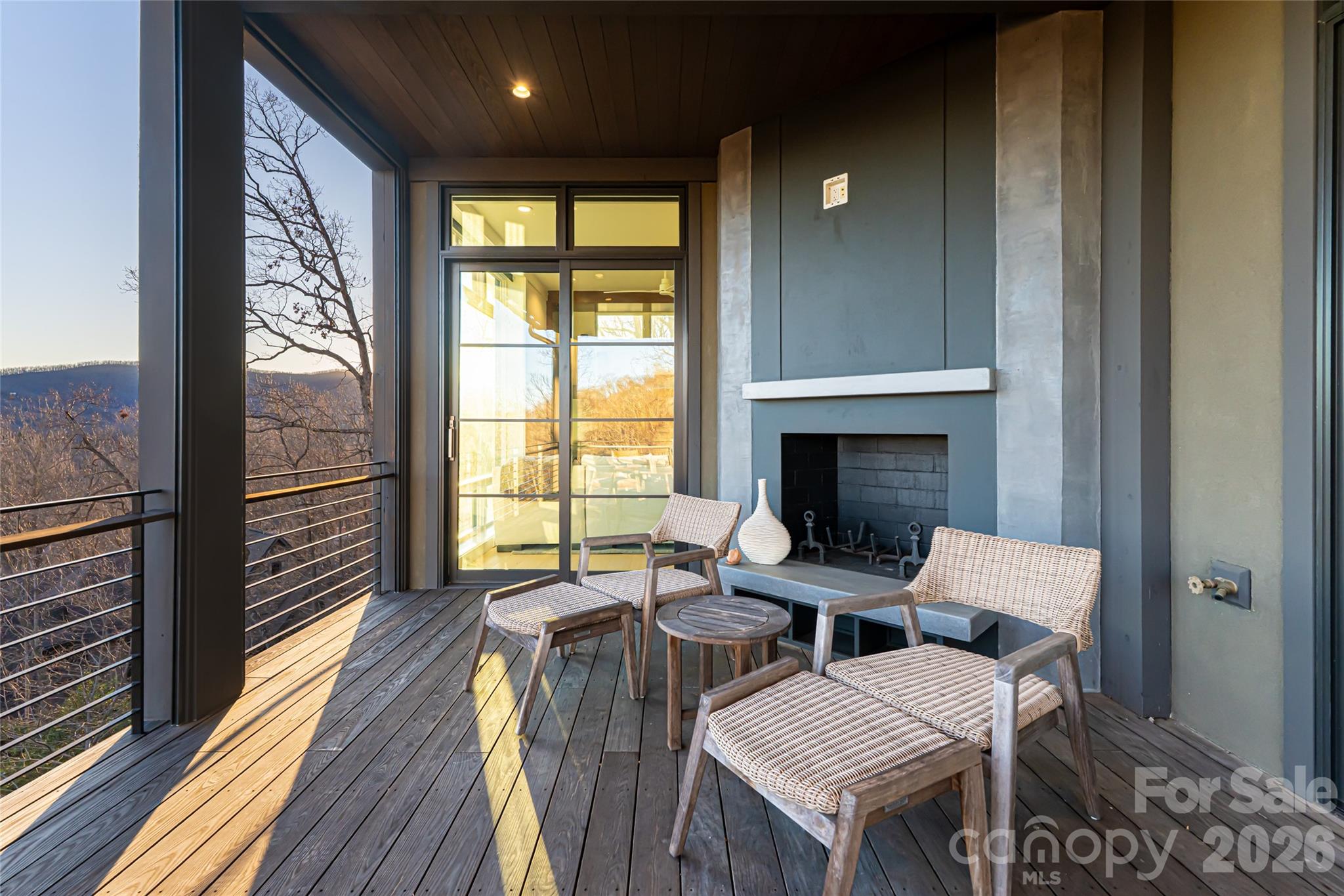 1121 Timberbluff Way Arden, NC 28704 - Photo 12 of 48 a balcony with furniture and wooden floor