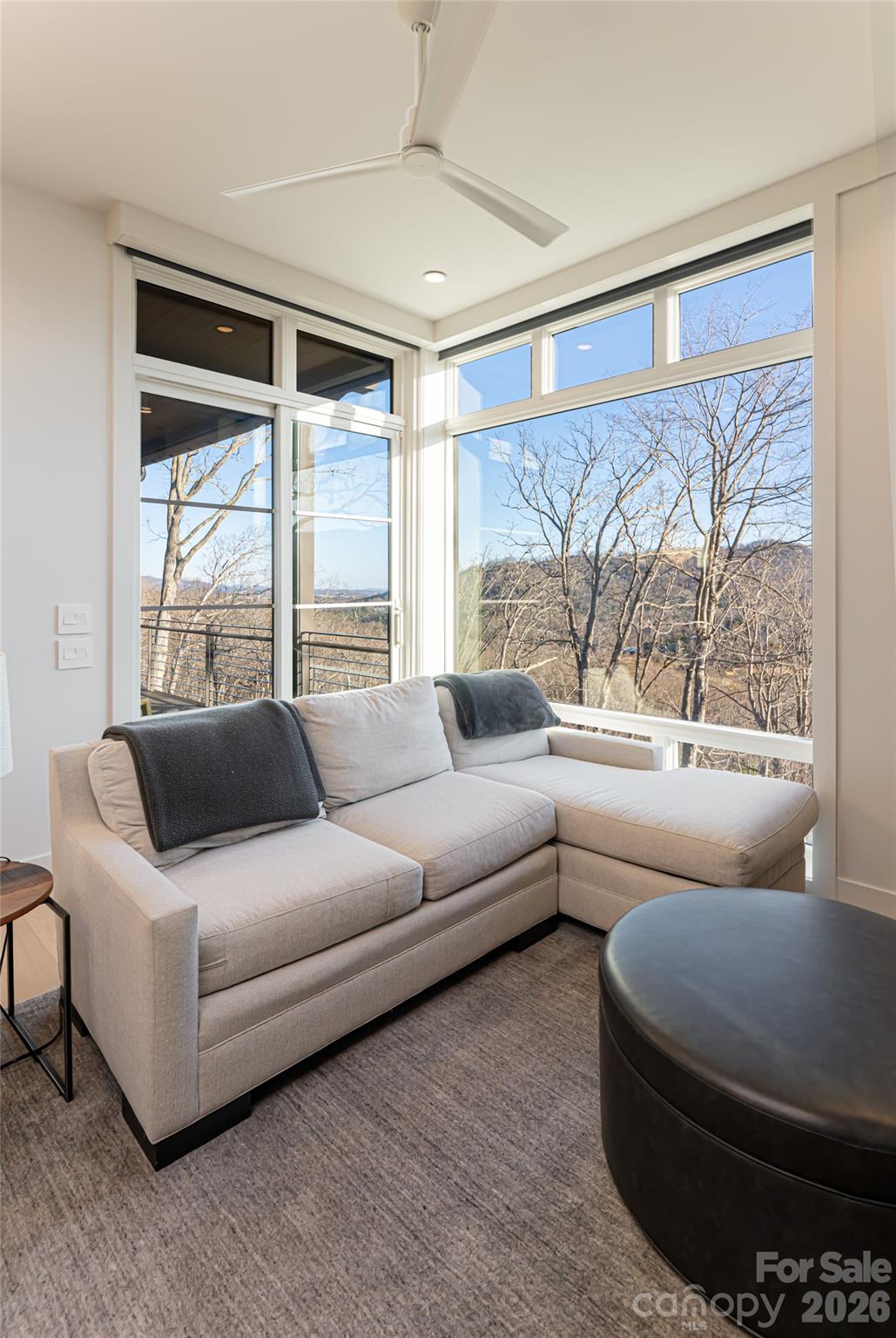 1121 Timberbluff Way Arden, NC 28704 - Photo 21 of 48 a living room with furniture and a large window