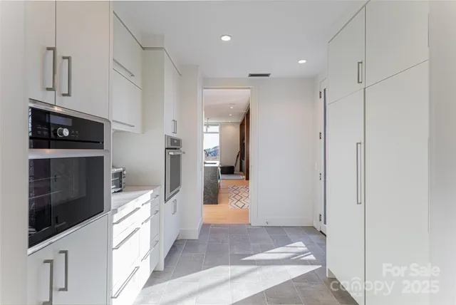 a view of a kitchen from the hallway