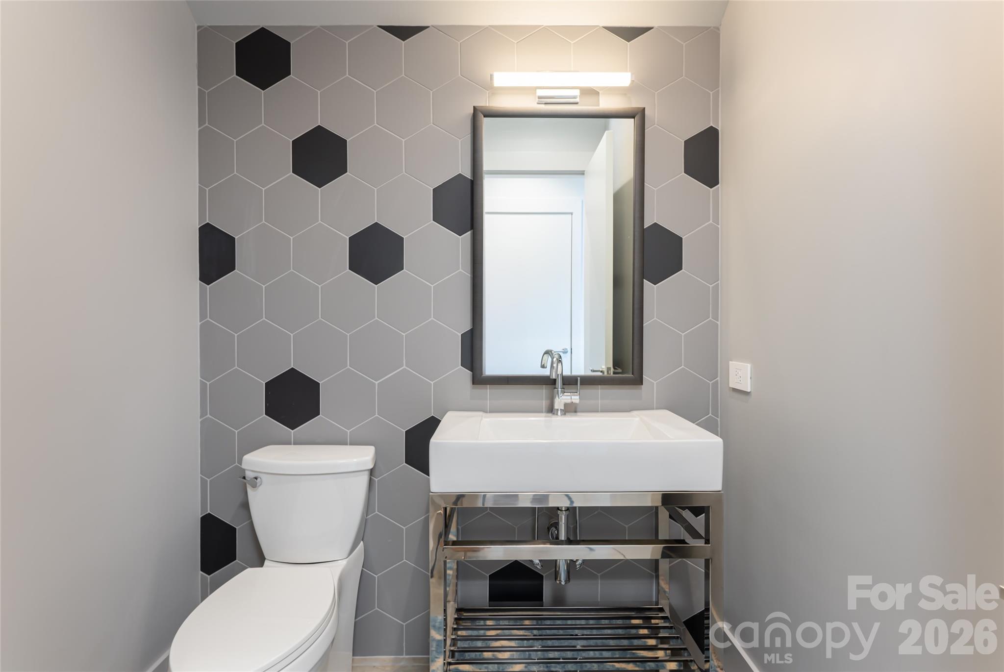 1121 Timberbluff Way Arden, NC 28704 - Photo 35 of 48 a bathroom with a sink toilet and shower