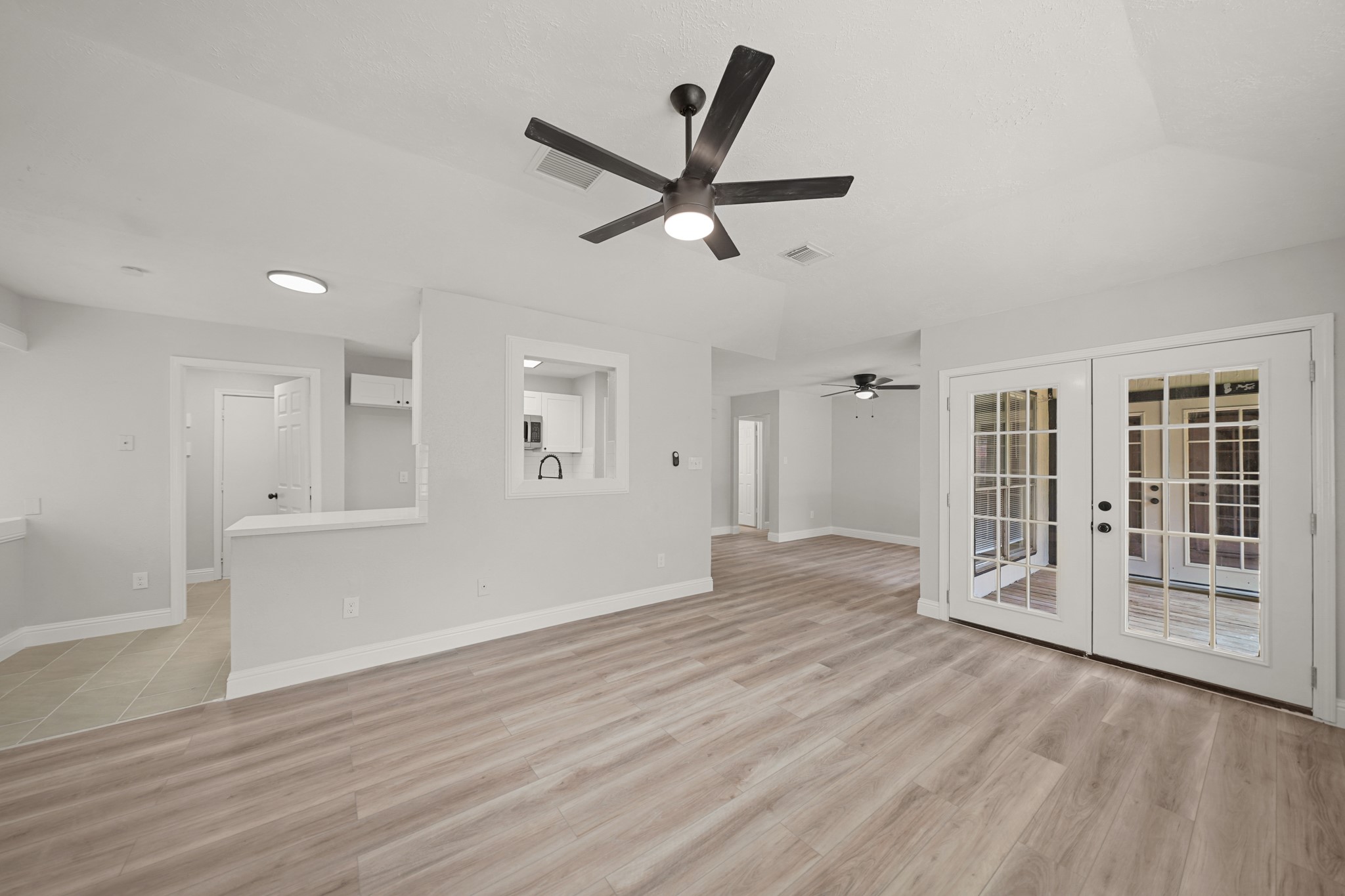 3623 Peachstone Place Spring, TX 77389 - Photo 7 of 20 a view of empty room with wooden floor and ceiling fan