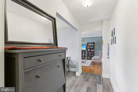 a room with furniture and wooden floor