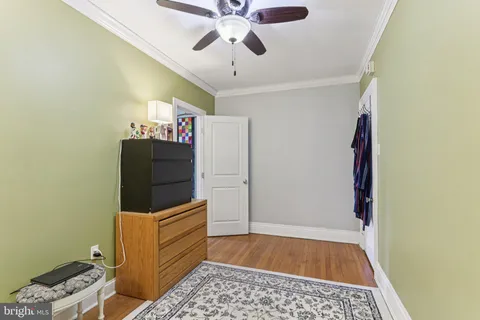 a view of room with window and ceiling fan