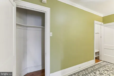 a view of walk in closet with empty room