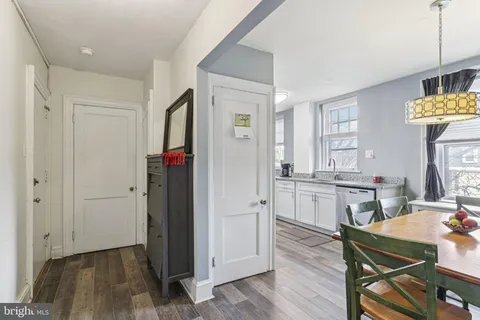 a view of kitchen and dining room with wooden floor