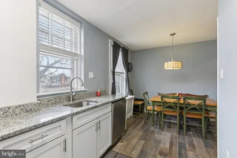 a spacious bathroom with a double vanity sink and a window