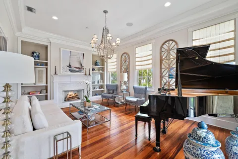 a living room with a couch and wooden floor