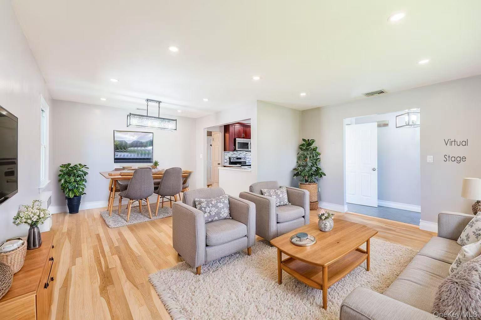 1253 Raymond Road North Bellmore, NY 11710 - Photo 2 of 7 a living room with furniture and wooden floor