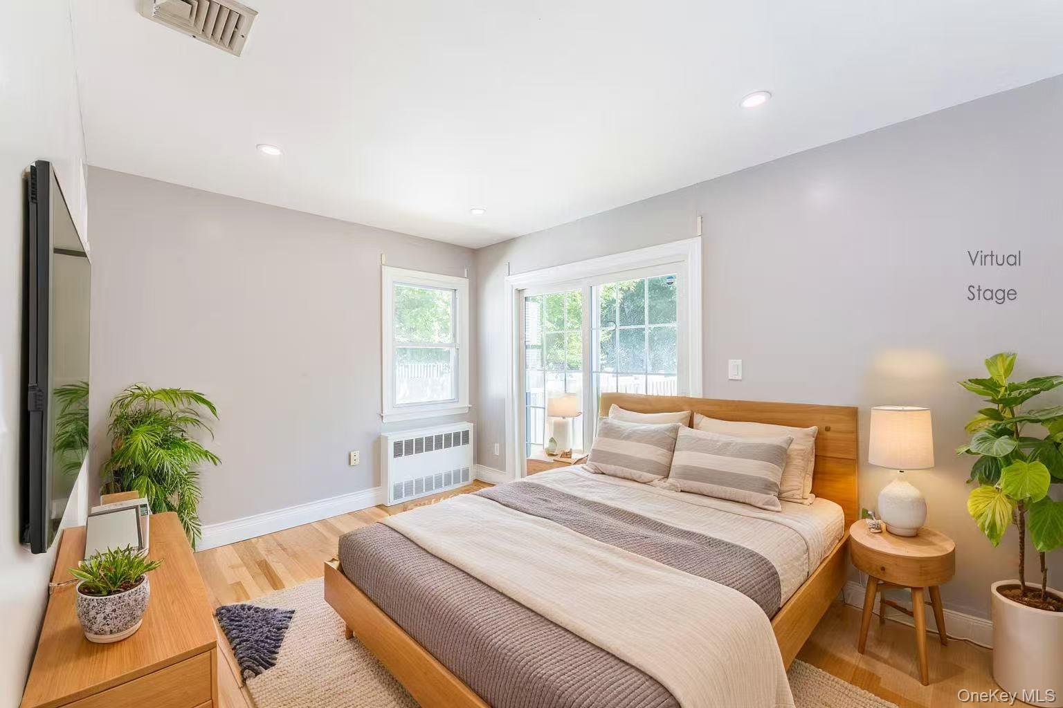 1253 Raymond Road North Bellmore, NY 11710 - Photo 3 of 7 a bedroom with a bed and a window