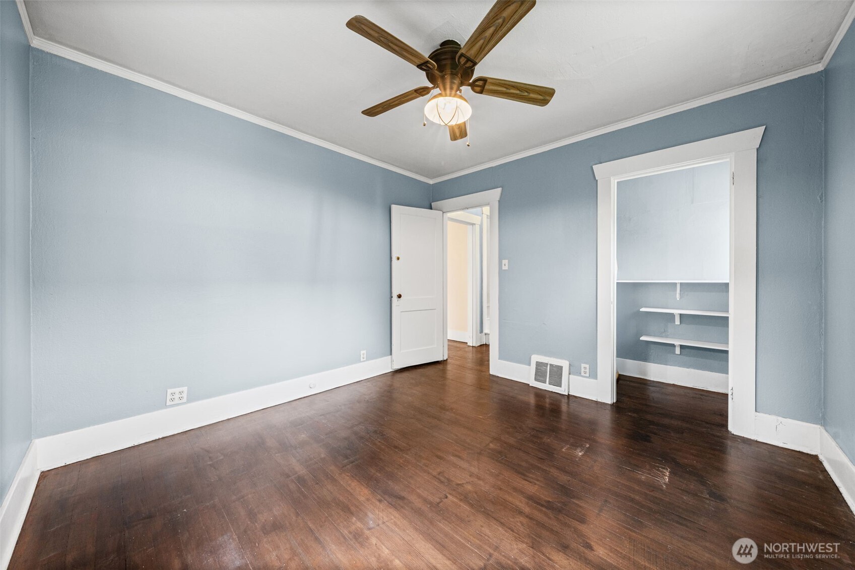 616 South Adams Street Tacoma, WA 98405 - Photo 12 of 26 an empty room with wooden floor and ceiling fan