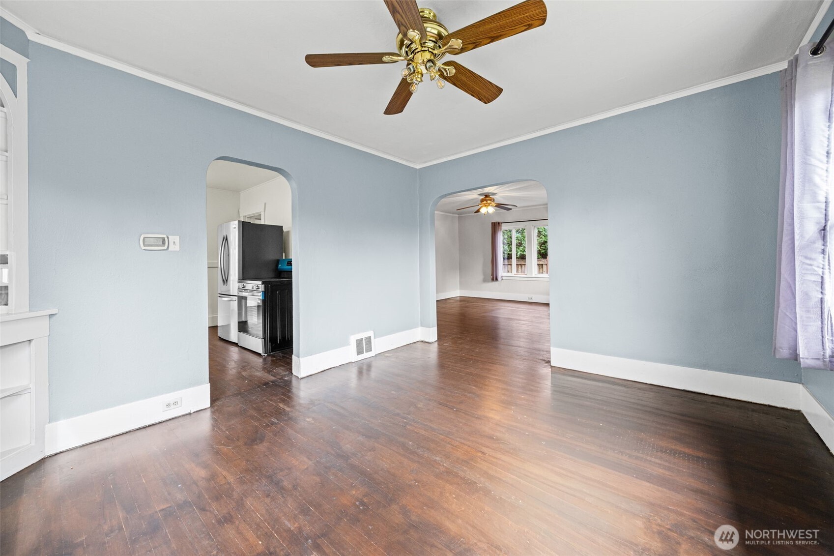 616 South Adams Street Tacoma, WA 98405 - Photo 14 of 26 wooden floor in an empty room with a window