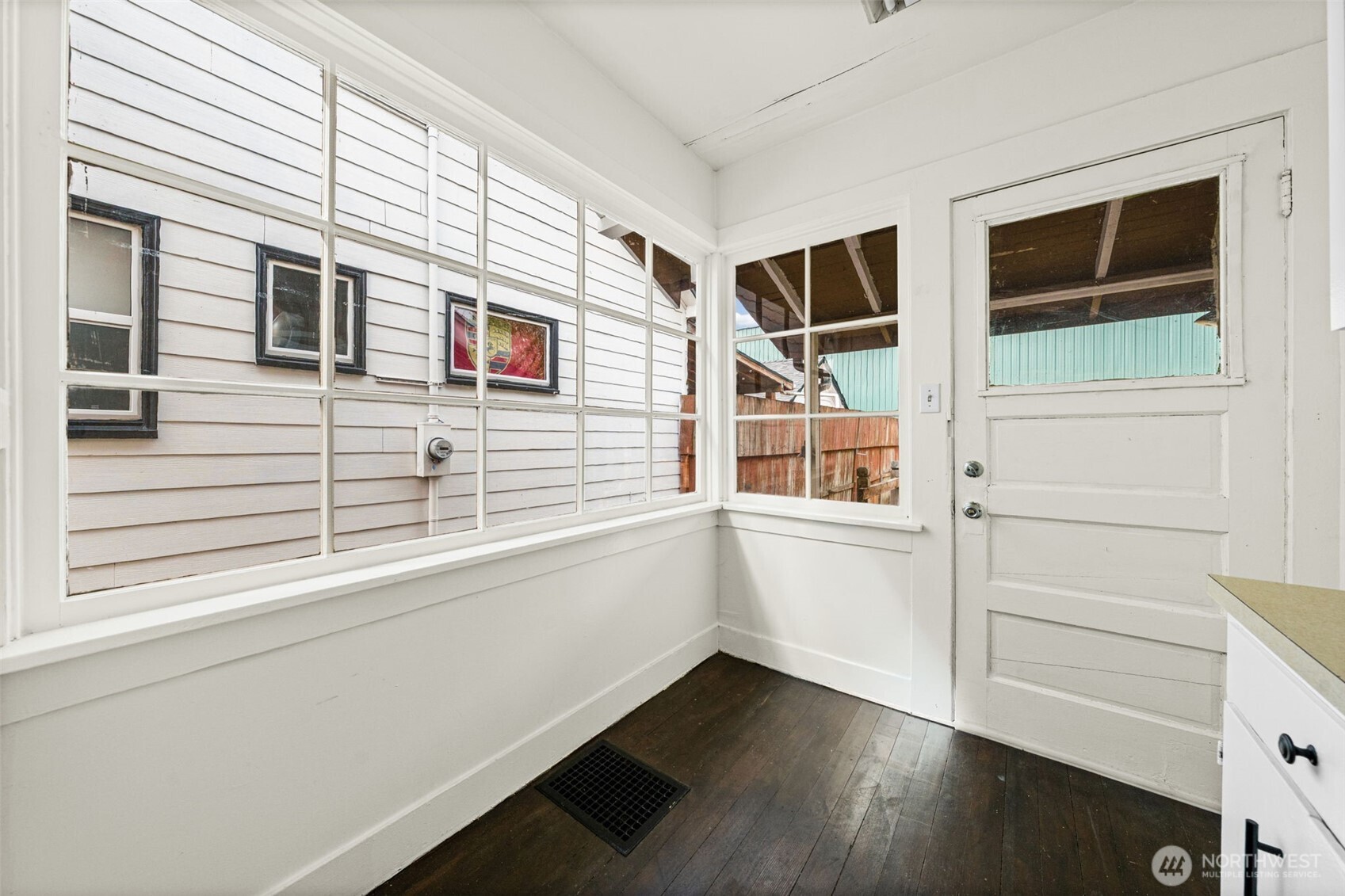 616 South Adams Street Tacoma, WA 98405 - Photo 21 of 26 a view of an entryway with wooden floor and windows