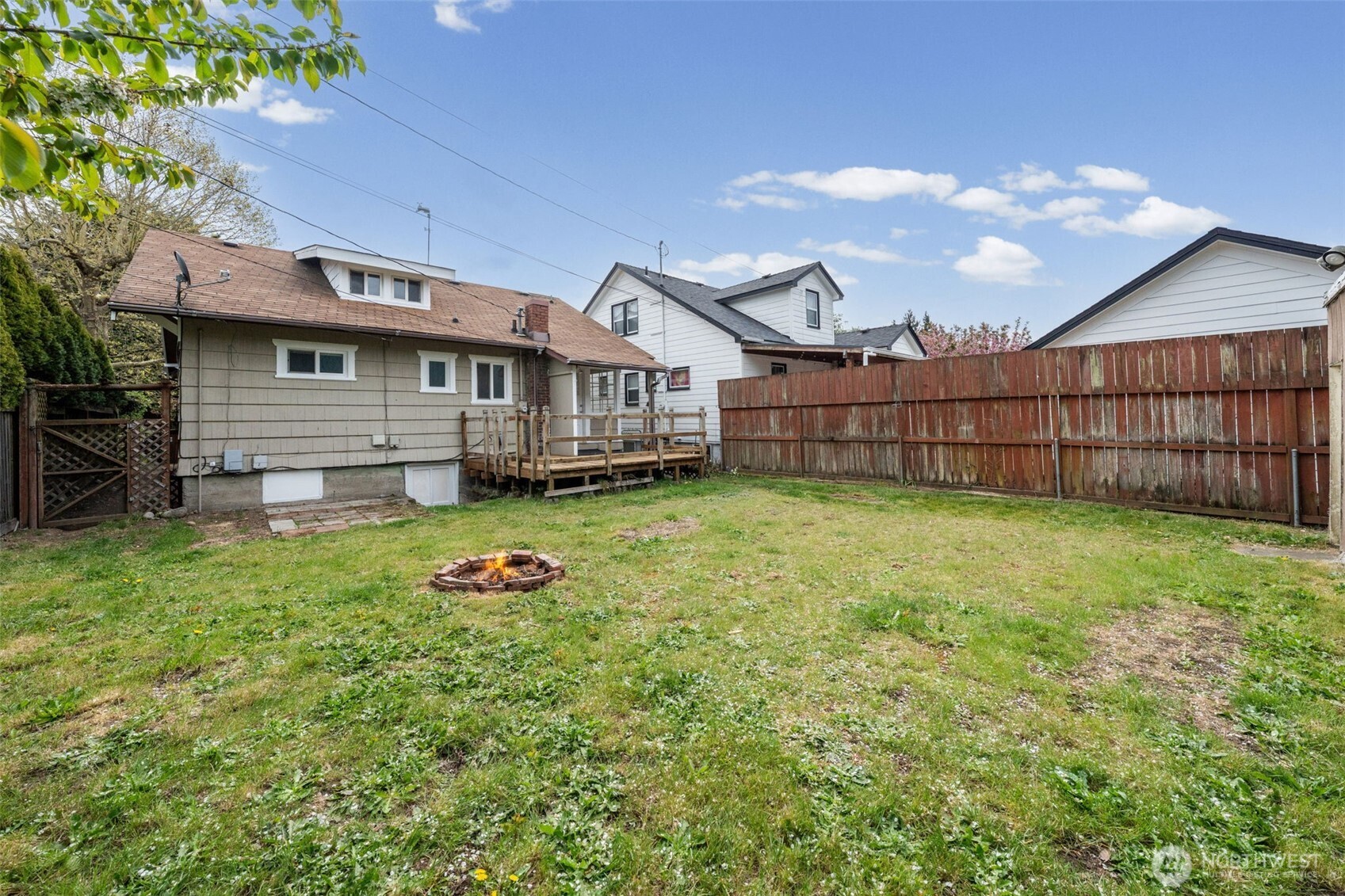 616 South Adams Street Tacoma, WA 98405 - Photo 22 of 26 a backyard of a house with wooden fence