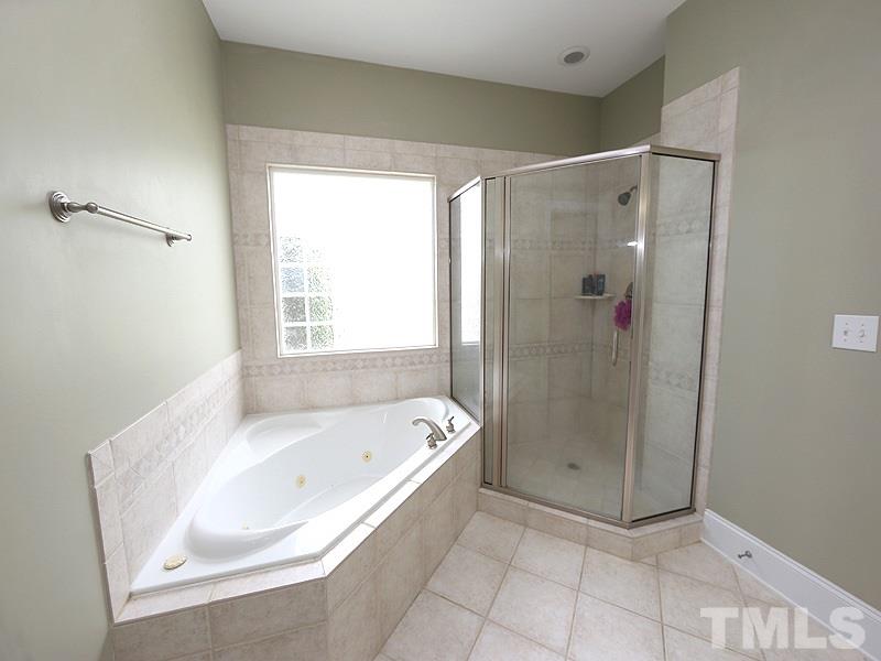 1024 Pasture View Lane Raleigh, NC 27603 - Photo 12 of 20 a spacious bathroom with a bathtub and a shower