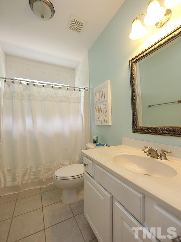 1024 Pasture View Lane Raleigh, NC 27603 - Photo 15 of 20 a bathroom with a granite countertop sink toilet and shower
