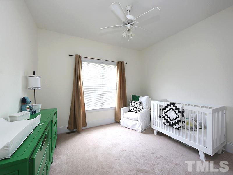 1024 Pasture View Lane Raleigh, NC 27603 - Photo 16 of 20 a bedroom with a bed and a chandelier