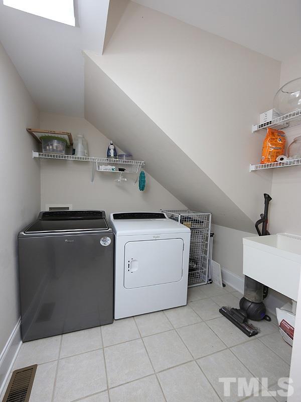1024 Pasture View Lane Raleigh, NC 27603 - Photo 18 of 20 a utility room with a washer and dryer