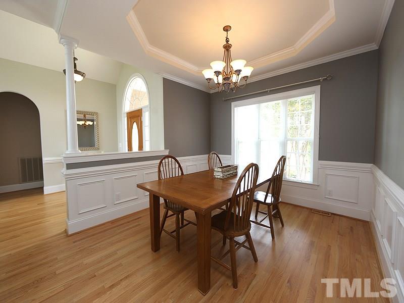 1024 Pasture View Lane Raleigh, NC 27603 - Photo 4 of 20 a view of a dining room with furniture window and wooden floor