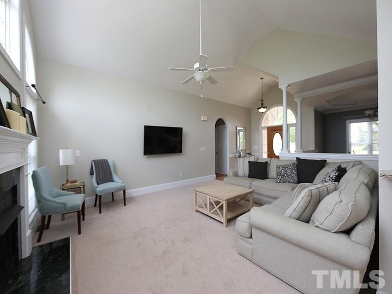 1024 Pasture View Lane Raleigh, NC 27603 - Photo 7 of 20 a living room with furniture and a flat screen tv