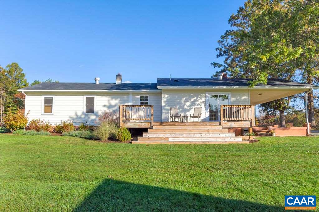 404 Blue Run Road Stanardsville, VA 22973 - Photo 11 of 43 a view of a house with backyard porch and sitting area