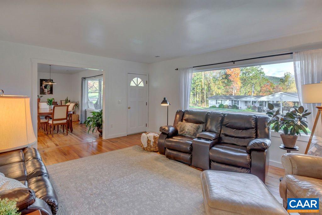 404 Blue Run Road Stanardsville, VA 22973 - Photo 15 of 43 a living room with furniture and a large window