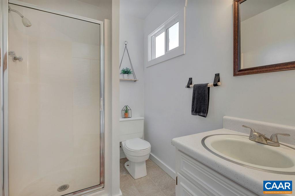 404 Blue Run Road Stanardsville, VA 22973 - Photo 32 of 43 a bathroom with a toilet a sink and a mirror